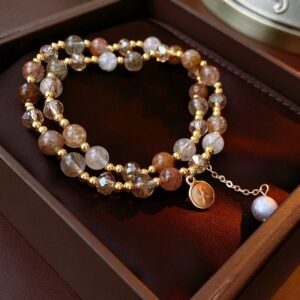 Gold-tone crystal charm wrap bracelet with natural stone-style beads in display box
