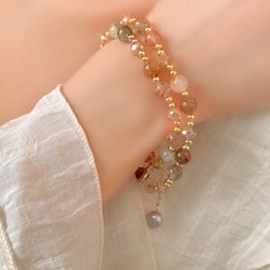 Natural stone beaded wrap bracelet with pearl-style dangling charm on wrist