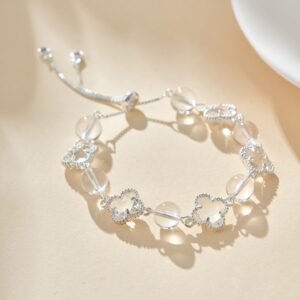 clear crystal four leaf clover bracelet with transparent beads and elegant silver details