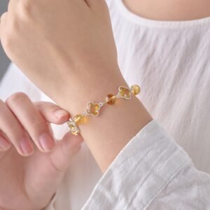 woman wearing honey amber lucky clover crystal bracelet on wrist