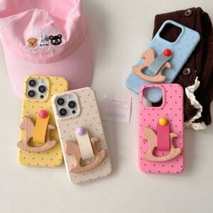 Polka Dot Rocking Horse iPhone Case in pastel pink blue yellow and cream colors