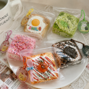 Cute bakery themed squishy toys collection including toast, matcha, strawberry and chocolate designs