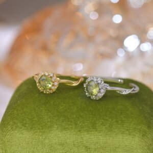 Green crystal open ring displayed in jewelry box